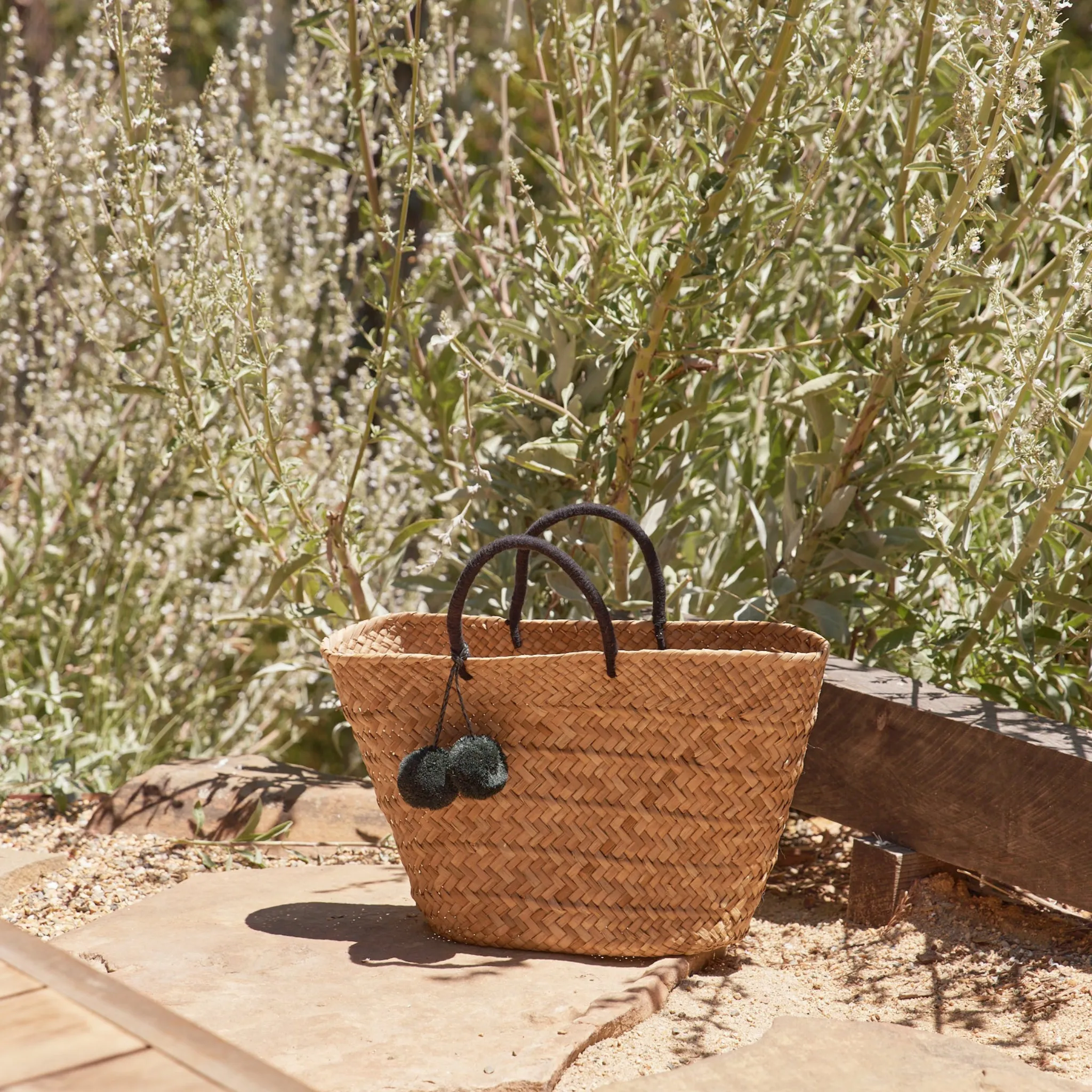 Oversized St Tropez Pom Pom Straw Tote in Black